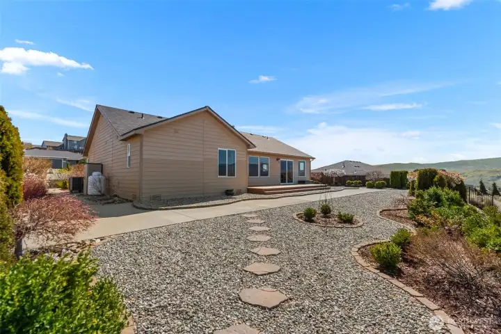 Concrete walkway around the home