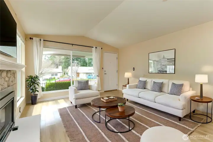 Variation of living room and entry way. Gas fireplace, plenty of natural lighting and vaulted ceilings.