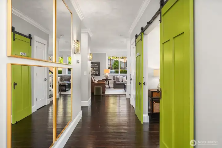 As you enter the home there is a living room and bedroom (set up as an office). Gleaming hardwood floors greet you in the thoughtfully designed home.