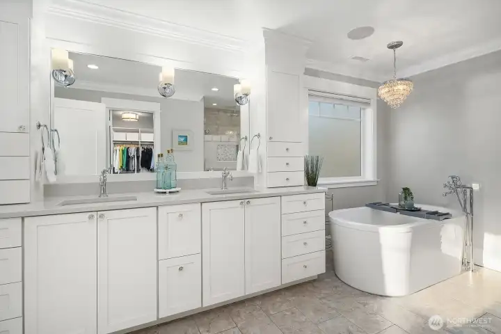 Spacious primary bath with soaking tub, large walk-in shower and walk-in closet.