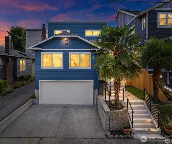 Two car garage plus 2 additional parking spots in driveway, very rare for lower QA!