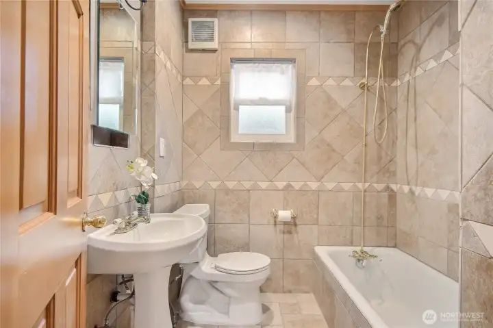 Main Level bathroom with shower right next to Main level bedroom