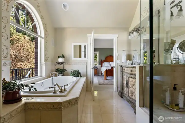 Master bath with jetted tub with water views