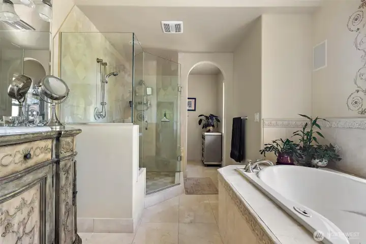 Glass enclosed shower with water views
