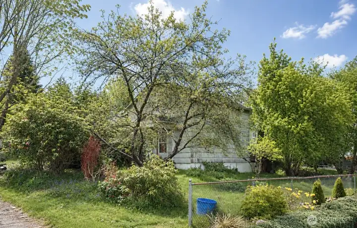 A large lot wraps around the home offering an abundance of outdoor space!