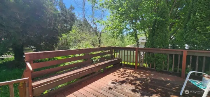 What a fantastic outdoor space! Solid deck has been well maintained and has built in seating.