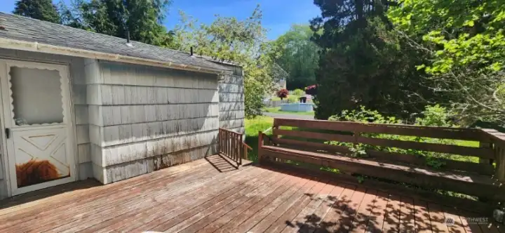 View towards back entry door into second living space. Multiple entry points to back deck.