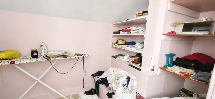 What a great closet! Additional storage on left side of photo.