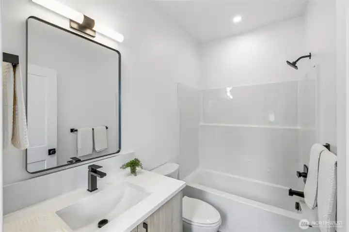 The full ensuite bathroom in the upper bedroom. The full ensuite bathroom in the upper bedroom.