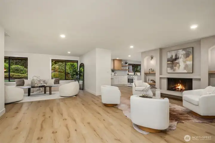 Secondary sitting room to the left offers views of the backyard, a stunning oasis.