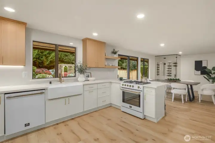 Kitchen opens to dinging room with wine cellar and slider to back patio.