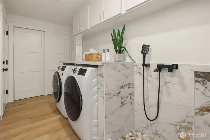 Mud room also houses brand new Washer / Dryer & utility closet.