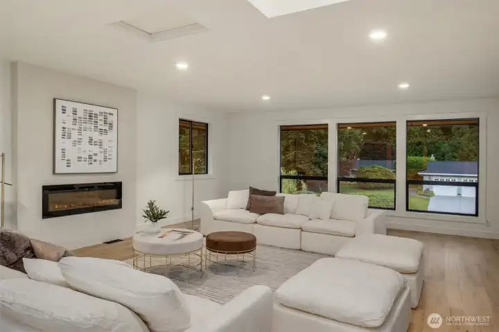 Upper Level bonus room offers large window for ample natural light and a fireplace.