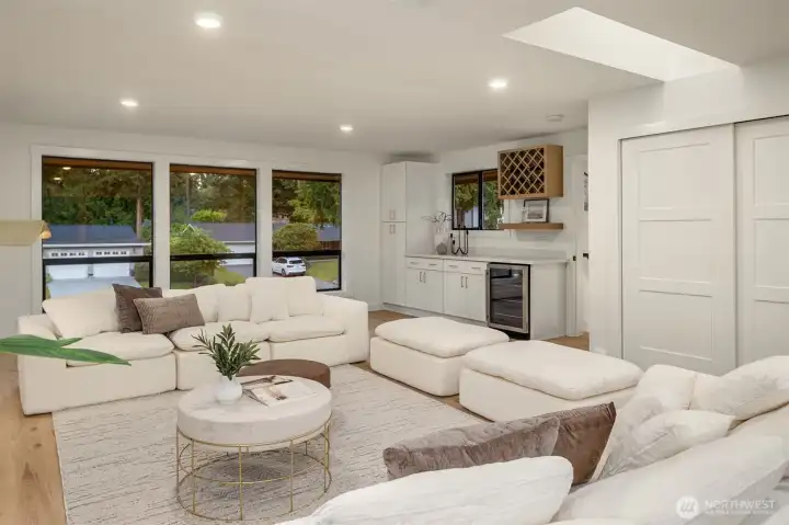 Upper Level bonus room ALSO boasts a skylight, Beverage Center, wine rack & built in cabinets.   -  Don't miss the hidden playroom behind the closet doors!