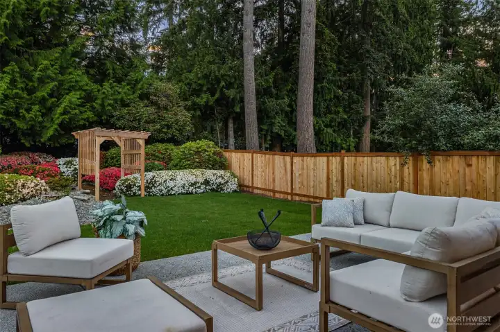 Enjoy the blooms of the mature landscaping as you relax and decompress from the day.