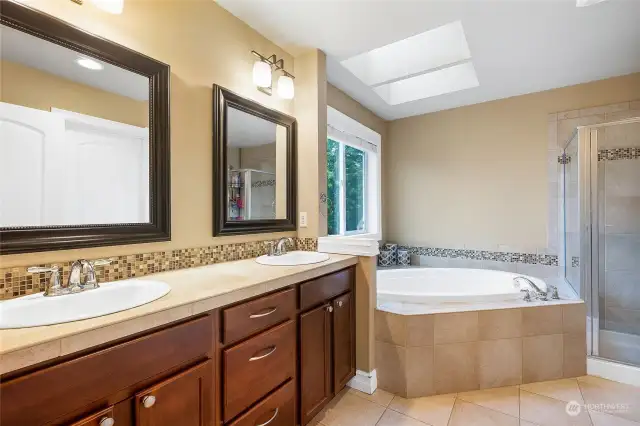 Master bath with double sinks, large garden tub and separate walk in shower.