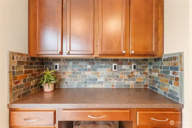 Beautiful tile backsplash and cabinets.
