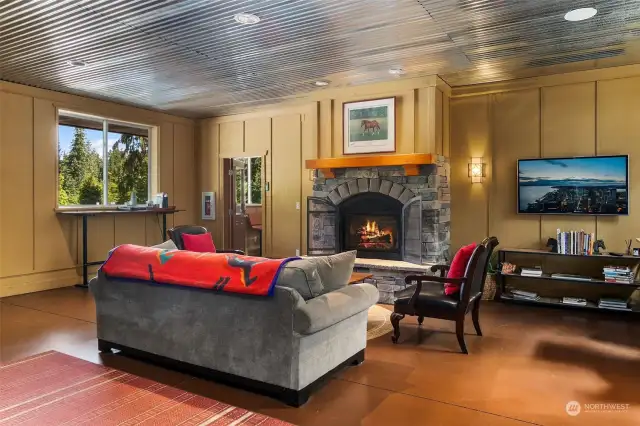 Heated lobby with fireplace and viewing area overlooking the indoor arena.