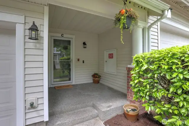This cute porch could easily fit a bistro table and chairs.  Morning coffee maybe?