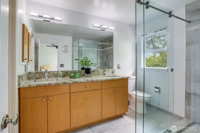 The frameless walk-in shower is not only chic, but easy to clean!