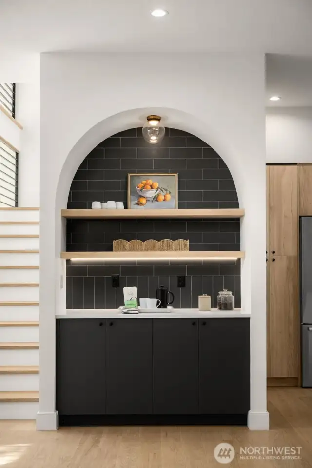 Chic arched coffee station or wine bar.