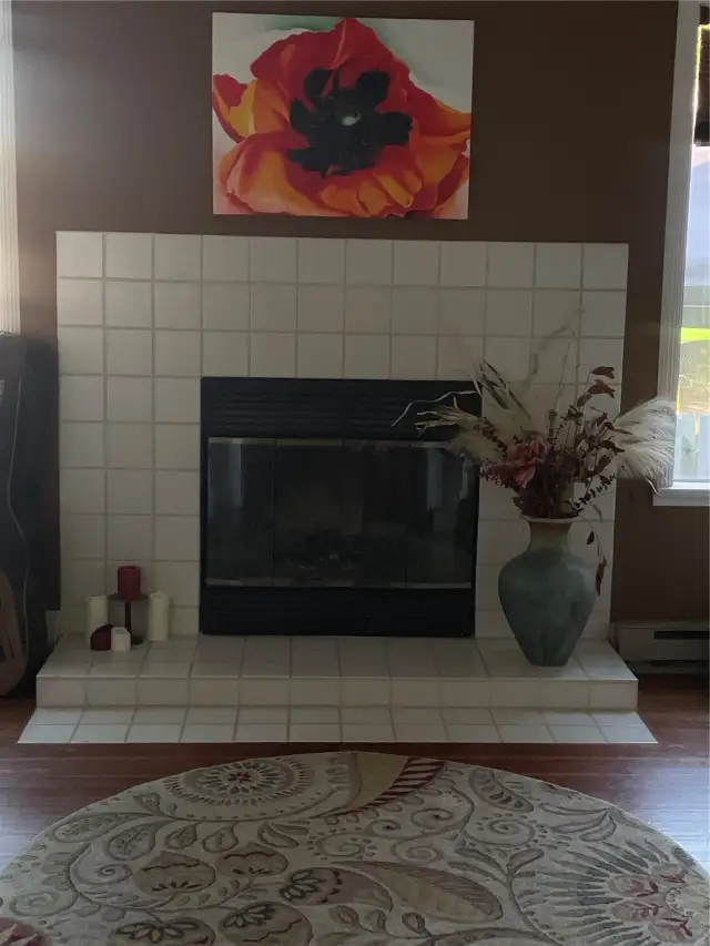 Looking into the adjacent library/office area with cozy wood burning insert.