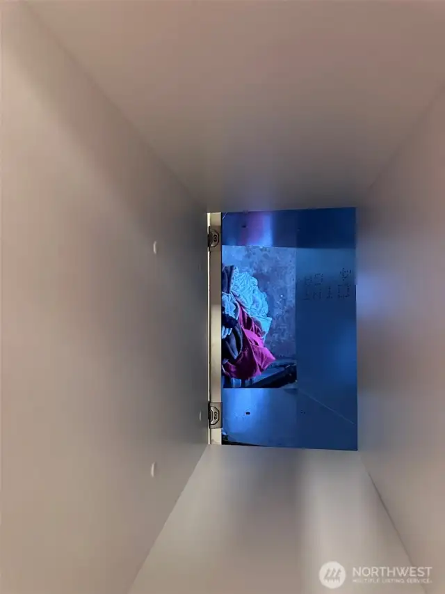 Down the chute into the basement laundry area!