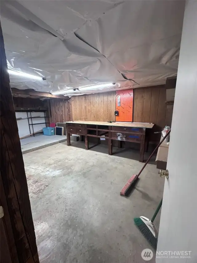Additional basement shop area with tons more storage.