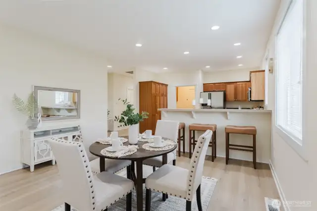 The dining area provides the perfect place to enjoy your favorite meal, with breakfast bar for extra seating.