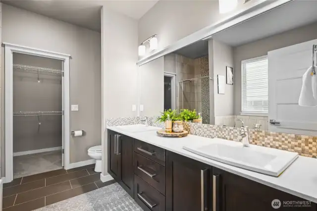 Luxurious 5-piece bath complete with a soaking tub, dual vanities, walk-in shower, and elegant finishes throughout.