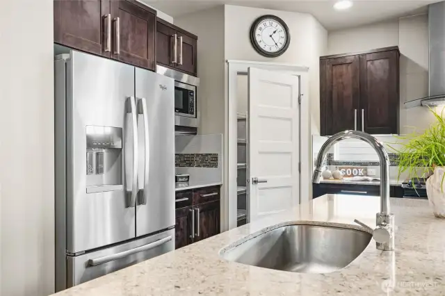 Refined design in the kitchen with a walk in pantry