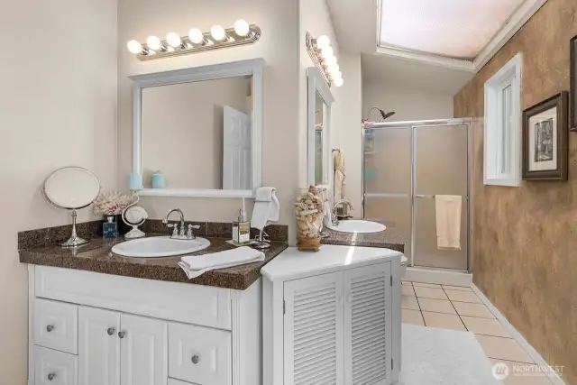 Ample sized En suite bath with double sinks and walk in shower