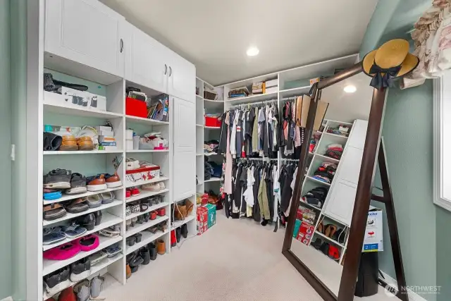 Closet space that feels like an extra room. Plenty of shelves and hanging space oh and big enough to change in and check yourself in the mirror. Don't miss the ironing board in the built in