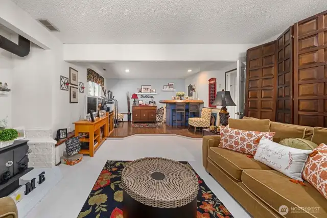Down stairs rec room has a wood burning stove and wet bar for entertaining. Potentially this area could be turned into a multi generational living space.
