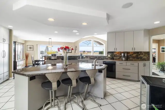 Large island in the middle of the kitchen is perfect for casual entertaining and is great for cooling off all those cookies!