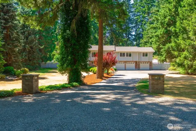 Sitting back off the road you can feel your self decompress as you enter the long driveway towards your home
