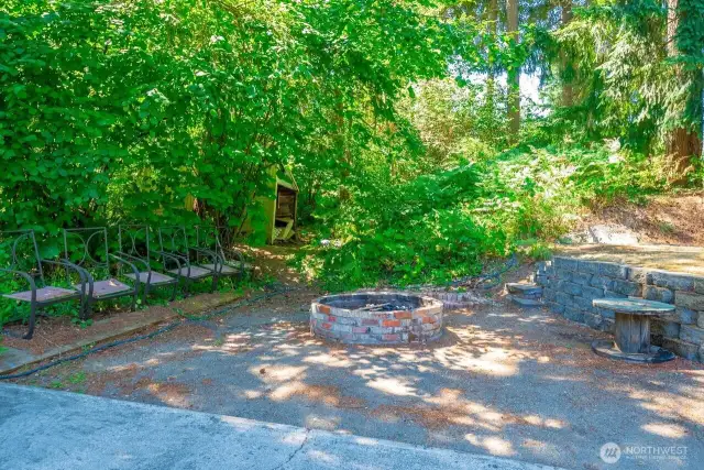 Cozy Fire pit at the back of the property adds a layer of seclusion while you gather round and enjoy your smores after a day of swimming!