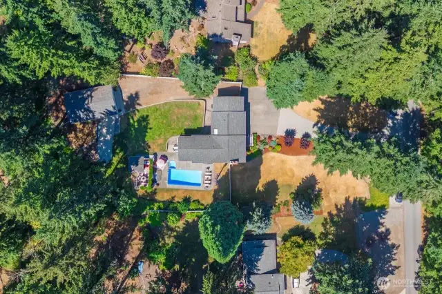 The aerial shot shows the location of the house to the pool area and detached shop and the long drive leading to the shop/garage.  This home has room for your RV, tons of cars or boats.  You name it there is probably room.