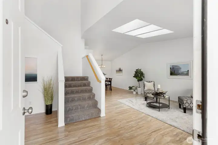 Beautiful Foyer with Laminate Flooring. Vaulted Ceilings in the Living Room with Skylights