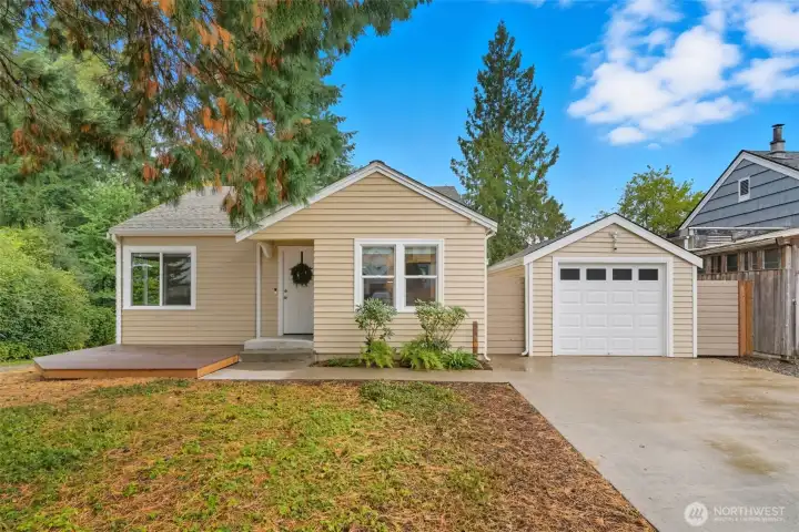 Beautifully maintained exterior with detached garage, and inviting curb appeal