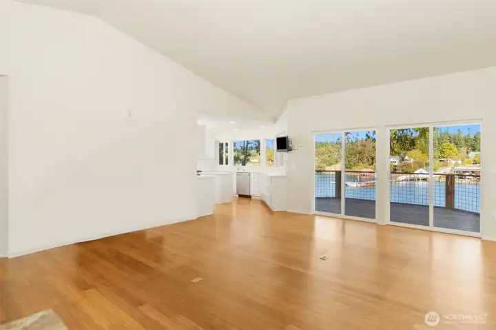 Great room w/ bamboo floors to covered deck & well-appointed kitchen.