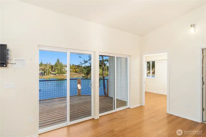 Living room sliders to covered deck.