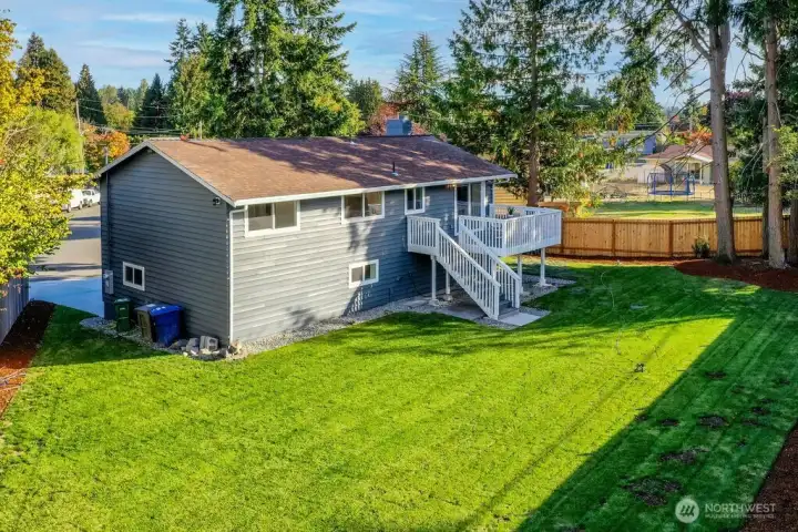 This spacious yard has confirmed eligibility under renton's Permit-Ready ADU program. On the other side of the fence is a curb cut with ready separate access.