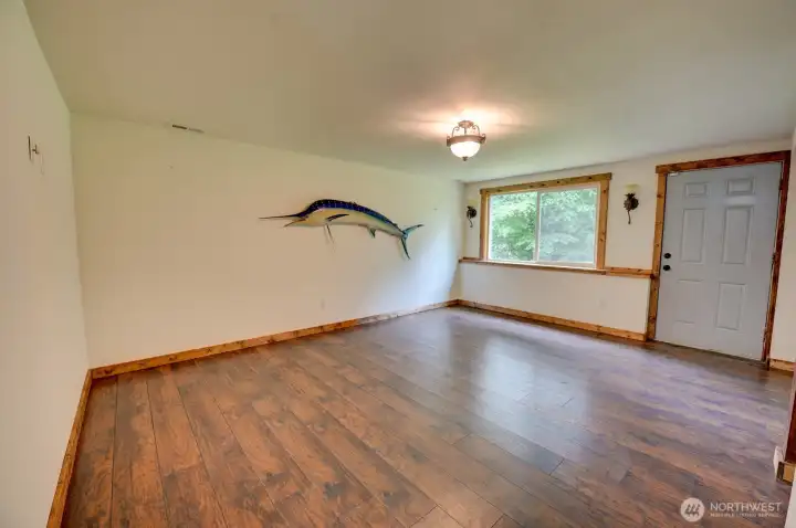 Lower level living/rec room space with exterior exit door.