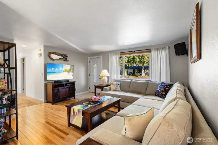 The living room captures northeast exposure and offers a cozy haven.