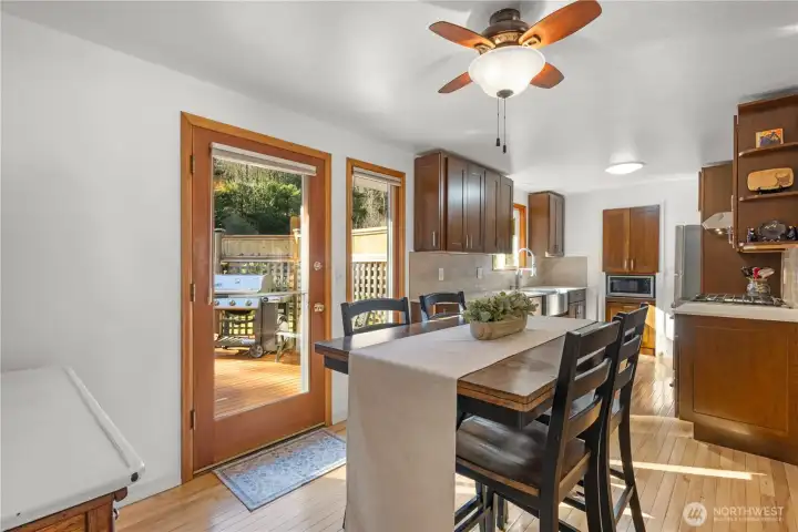 From the living room, the dining room marries the kitchen and access to the deck & backyard.