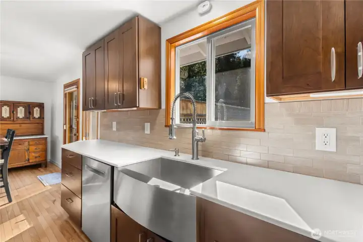 The deep stainless steel sink overlooks the backyard.