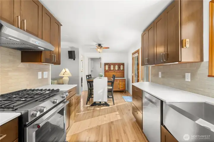 A view of the kitchen looking towards the dining nook and laundry.