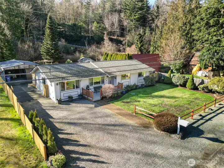 An aerial view of the property with the gate open,