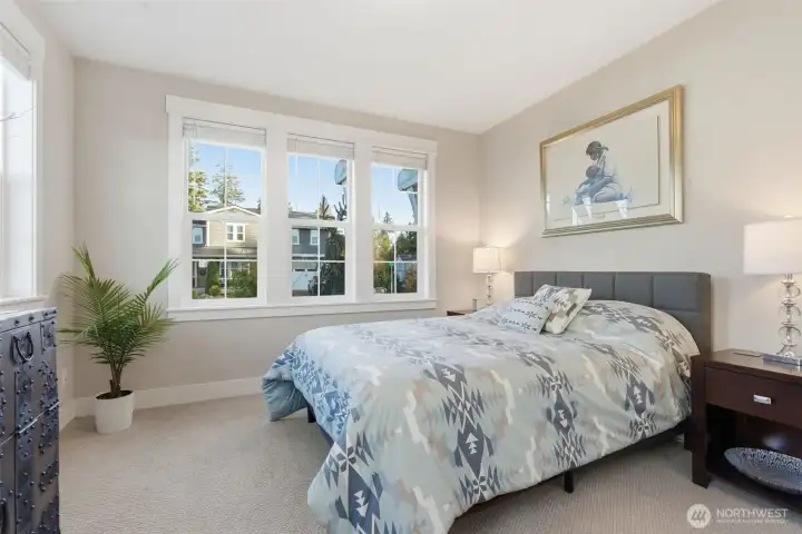 The main floor bedroom is perfect for visitors or as a home office.